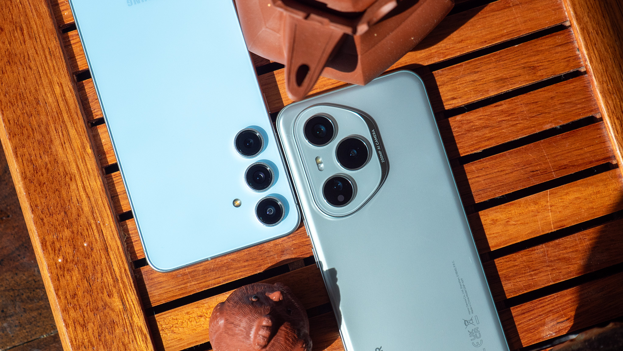 Comparing the backs and camera configurations of the Honor 400 Pro vs Samsung Galaxy S24 FE